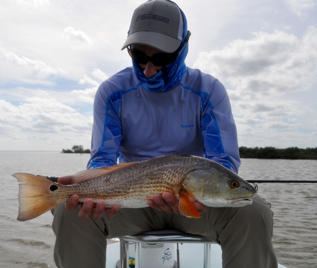 German Fly Angler, Chris, admiring his first Redfish. For those of you who have experienced this, you can understand that moment and feeling of putting your hands on that first caught species. Its an intense moment and I love getting to share it with clients over and over.
