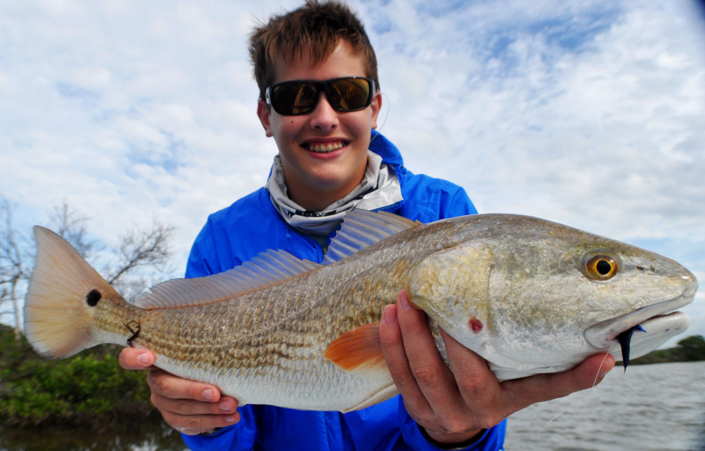 Stone, from Orlando, showing off his largest redfish to date. I can guarantee you, Stone will never forget watching this fish absolutely crush a hand tied shrimp fly in a foot of water.